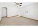 Cozy living room with neutral carpet, arched entryway, and bright natural light at 225 E 36Th St, Anderson, IN 46013