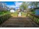 A new wooden deck overlooks the backyard, perfect for relaxation and outdoor entertaining at 241 S Rural St, Indianapolis, IN 46201