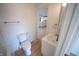 A bright bathroom with white vanity, tub and toilet provides a clean and functional space at 241 S Rural St, Indianapolis, IN 46201