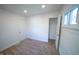A bright bedroom with neutral carpet, closet and single window offers a peaceful retreat at 241 S Rural St, Indianapolis, IN 46201