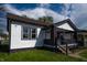 Charming home exterior with a covered porch and updated paint scheme, enhanced curb appeal at 241 S Rural St, Indianapolis, IN 46201
