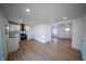 Open concept kitchen featuring new stainless appliances, white cabinets, and modern finishes at 241 S Rural St, Indianapolis, IN 46201