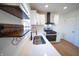 Beautiful kitchen showcasing white cabinetry, stainless steel appliances and modern faucet at 241 S Rural St, Indianapolis, IN 46201