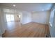 Open concept living room with modern floors, recessed lighting, and white trim at 241 S Rural St, Indianapolis, IN 46201