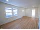Newly renovated living room featuring new floors, recessed lighting and neutral paint at 241 S Rural St, Indianapolis, IN 46201