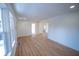 Bright and airy living room featuring new floors, recessed lighting and neutral paint at 241 S Rural St, Indianapolis, IN 46201
