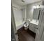 Full bathroom with a shower-tub combo, vanity, toilet, and vinyl flooring at 2448 Winfield Ave, Indianapolis, IN 46222
