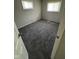 Cozy bedroom with neutral paint, carpeted floors, and natural light from windows at 2448 Winfield Ave, Indianapolis, IN 46222