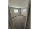 Bright bedroom featuring neutral walls, carpeted floors, and windows providing ample natural light at 2448 Winfield Ave, Indianapolis, IN 46222