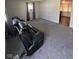 Empty living room with gray carpet and neutral paint, allowing for versatile design options at 2448 Winfield Ave, Indianapolis, IN 46222