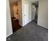 Open-concept space with neutral walls and carpet, seamlessly connecting living area to the kitchen at 2448 Winfield Ave, Indianapolis, IN 46222