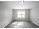 Bright bedroom features neutral walls, carpet, and a window offering natural light at 270 S Lasalle St, Indianapolis, IN 46201