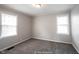 Bedroom with neutral walls, carpet, and natural light from the two windows at 270 S Lasalle St, Indianapolis, IN 46201
