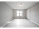 A bright living room with neutral colors and natural light, featuring laminate floors at 270 S Lasalle St, Indianapolis, IN 46201