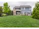 Spacious backyard with black metal fence, in-ground pool, and covered patio providing an ideal space for relaxation at 2785 W High Grove Cir, Zionsville, IN 46077