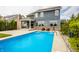 Large backyard with in-ground pool, covered patio, and basketball hoop provides ample recreational space at 2785 W High Grove Cir, Zionsville, IN 46077