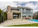 Expansive backyard with pool, covered patio, and brick accents offers an ideal outdoor living space at 2785 W High Grove Cir, Zionsville, IN 46077