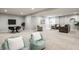 Large finished basement featuring a sitting area, a table with chairs, and neutral carpet flooring at 2785 W High Grove Cir, Zionsville, IN 46077