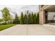 Home basketball court with privacy landscaping and views of the pond and surrounding homes at 2785 W High Grove Cir, Zionsville, IN 46077