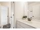 Bright bathroom showcasing a white vanity, mirror, and ample lighting, perfect for daily routines and self-care at 2785 W High Grove Cir, Zionsville, IN 46077