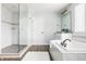 Bathroom boasting a soaking tub, separate shower, double vanity, and wood-look flooring at 2785 W High Grove Cir, Zionsville, IN 46077