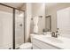 Modern bathroom featuring a glass-enclosed shower, white vanity, and contemporary fixtures, offering a clean and functional space at 2785 W High Grove Cir, Zionsville, IN 46077