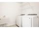 Functional laundry room with new white washer, dryer, sink, and practical shelving at 2785 W High Grove Cir, Zionsville, IN 46077