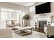 Comfortable living room showcasing a fireplace with mantel, hardwood floors, and natural light at 2785 W High Grove Cir, Zionsville, IN 46077