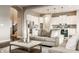 Open-concept living room and kitchen with hardwood floors and neutral color palette at 2785 W High Grove Cir, Zionsville, IN 46077