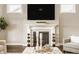 Elegant living room featuring a fireplace, flat-screen TV, and decorative mantel at 2785 W High Grove Cir, Zionsville, IN 46077
