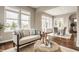 Comfortable living area with views into the dining area, and with large windows for plenty of natural light at 2785 W High Grove Cir, Zionsville, IN 46077