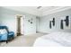 Bright main bedroom with carpet flooring, tray ceiling, and ensuite bathroom entrance at 2785 W High Grove Cir, Zionsville, IN 46077