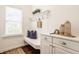 Bright mudroom featuring built-in bench with storage, hooks, and stylish decor accents at 2785 W High Grove Cir, Zionsville, IN 46077