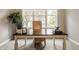 Bright office space with large window, wooden desk, and minimalist decor perfect for a work from home setup at 2785 W High Grove Cir, Zionsville, IN 46077