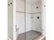 Close up of the walk-in shower with rain shower head, shower seat, and mosaic tile accent at 2785 W High Grove Cir, Zionsville, IN 46077
