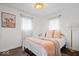 Bright and airy bedroom featuring a large window, soft bedding, and natural light at 3134 Orchard Ave, Indianapolis, IN 46218
