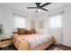 Cozy bedroom with hardwood floors, comfortable bedding, and natural light from the windows at 3134 Orchard Ave, Indianapolis, IN 46218