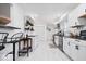 Bright kitchen featuring white cabinetry, subway tile backsplash, and modern appliances at 3134 Orchard Ave, Indianapolis, IN 46218