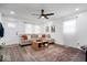Spacious living room featuring a comfortable sectional sofa, stylish rug, and modern lighting at 3134 Orchard Ave, Indianapolis, IN 46218