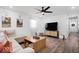 Inviting living room with a cozy sectional, modern decor, and plenty of natural light at 3134 Orchard Ave, Indianapolis, IN 46218