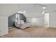 Finished attic bedroom with sloped ceilings, a plush bed, and cozy decor at 3221 Washington St, Columbus, IN 47203