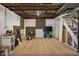 Finished basement is carpeted and contains storage options, with the staircase to the upper floor at 3221 Washington St, Columbus, IN 47203