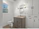 Bathroom features a neutral vanity, built in storage, and a window providing ample natural light at 3221 Washington St, Columbus, IN 47203