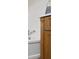 Close-up of the bathtub faucet, controls, and vanity with decorative wood trim in a bright bathroom at 3221 Washington St, Columbus, IN 47203