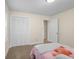Bedroom featuring closet with bifold doors, neutral paint and carpet at 3221 Washington St, Columbus, IN 47203