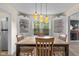 Inviting dining room with built-in cabinets and a view into the cozy living area with fireplace at 3221 Washington St, Columbus, IN 47203