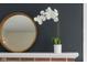 Stylish decor on the fireplace mantel, including a round mirror and elegant floral arrangement at 3221 Washington St, Columbus, IN 47203