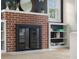 Close-up of the living room's inviting fireplace with decorative mantle and surrounding built-in shelves at 3221 Washington St, Columbus, IN 47203