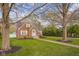 Beautiful home with brickwork, tidy garden, and symmetrical windows at 3221 Washington St, Columbus, IN 47203