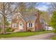 An attractive brick home exhibits traditional architecture and a neatly kept yard at 3221 Washington St, Columbus, IN 47203
